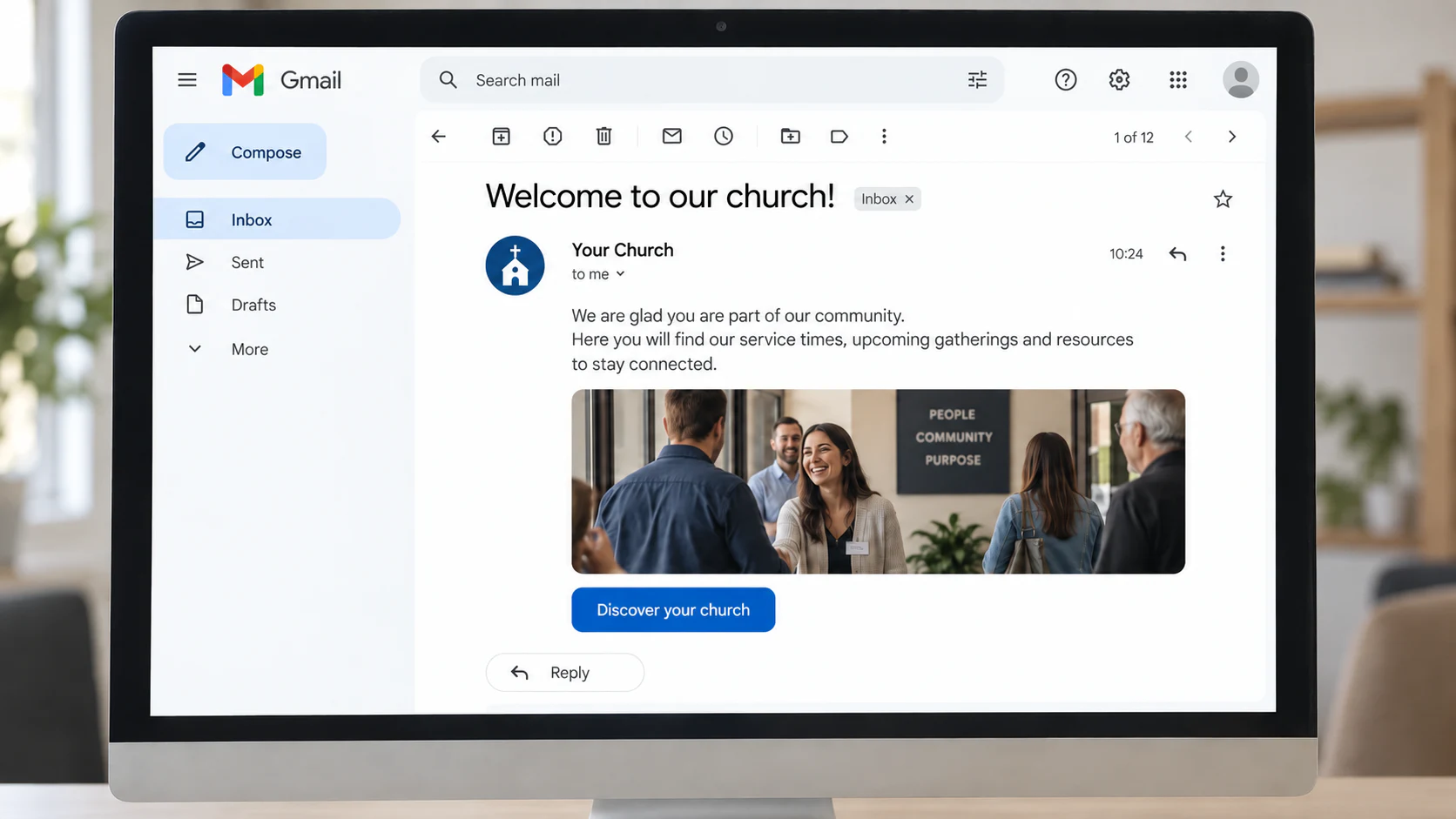 Desktop computer displaying a church welcome email in Gmail.